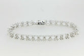 Custom sterling silver semi mount tennis bracelet setting with round stone placeholders.